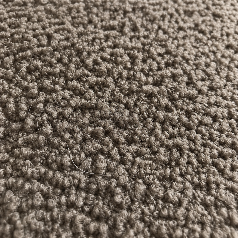 Detalle de cerca del textil boucle del sofa de Carlos